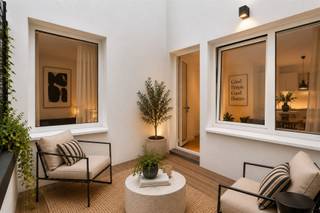 <p><b>Elegant Apartment in the Heart of Antwerp</b></p><p>Welcome to this beautiful 2-bedroom apartment located in lively Antwerp. With a living area of 73m² and a total ground area of 83m², this property offers the perfect balance of comfort and efficiency for modern residents.</p><p><b>Main features:</b></p><p>This charming apartment features two spacious bedrooms, each with natural light and wooden floors that add warmth and character. The first bedroom has access to windows with views, while the second bedroom is ideal for guest accommodation or as a work space.</p><p><b>Living space:</b></p><p>The open and spacious living room is the heart of the home, equipped with large windows that let in plenty of natural light. This airy space is perfect for both relaxing and entertaining and creates a seamless connection to other parts of the apartment.</p><p><b>Kitchen and Plumbing:</b></p><p>The modern kitchenette is practical and well laid out with all the necessary appliances. The single bathroom features a pleasant layout, including a black-tiled shower stall and a modern sink unit.</p><p><b>Additional Spaces:</b></p><p>The apartment also features a practical toilet, an entrance hall with storage space, and an excellent layout that offers maximum functionality.</p><p><b>Balcony and Outdoor Space:</b></p><p>Enjoy a private balcony or terrace with wooden decking, perfect for relaxation and as an extension of your living space.</p><p><b>Benefits of this Location:</b></p><p>This apartment is ideally located in Antwerp, close to stores, restaurants, public transportation and cultural attractions. The modern architecture and minimalist design make this a desirable place for professionals and starters.</p><p>This is a unique opportunity to own a stylish, well-maintained home in the heart of Antwerp.</p>