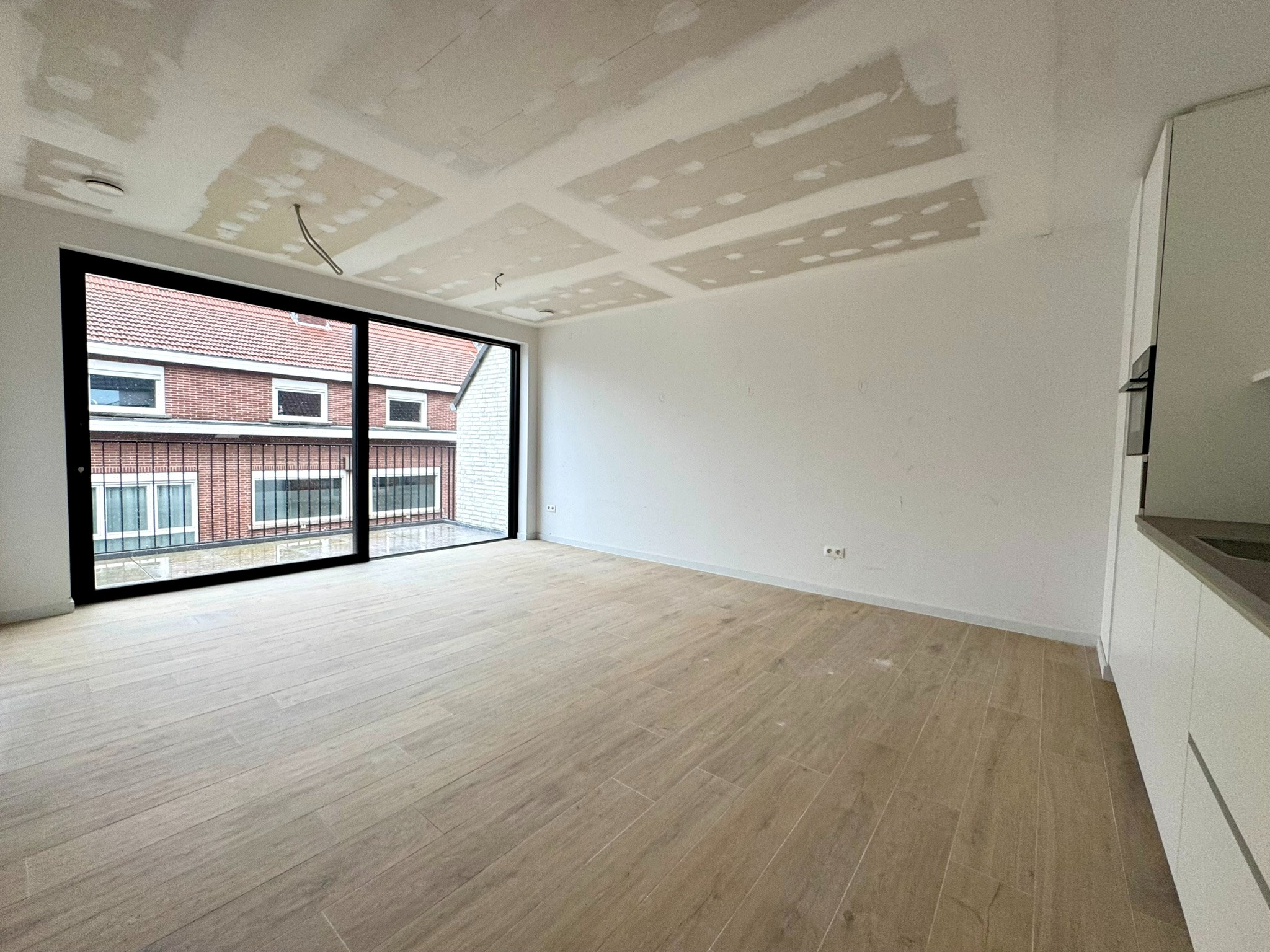 Nieuwbouwappartement (70m²) met 1 slaapkamer, staanplaats en kelderberging - foto 2