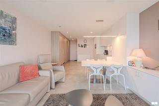 Welcome to this modern, stylish apartment in Middelkerke with direct access to the beach. This luxury landscaped property combines elegance, comfort and an exceptional seaside location.The studio features an open, bright floor plan with seamless connection between living, dining and kitchen areas. The state-of-the-art kitchen features quality appliances and countertops with everything you need for comfortable living. Divided into several rooms, you will find a full bathroom with luxury shower and modern plumbing fixtures.The interior exudes tranquility and sophistication with neutral color tones, natural materials and sophisticated finishes. Beautiful large windows and glass doors offer spectacular views of the sea and beach, while allowing maximum natural light in.The highlight is undoubtedly the expansive balcony or terrace with panoramic sea views. This is the ideal place to enjoy coastal life, watch the sunrise and soak up the sea breeze.The building has a prime location right on Middelkerke beach and offers access to excellent amenities and vibrant coastal life.Possibility to purchase pitch in the building for an additional cost of 60,000 euros.