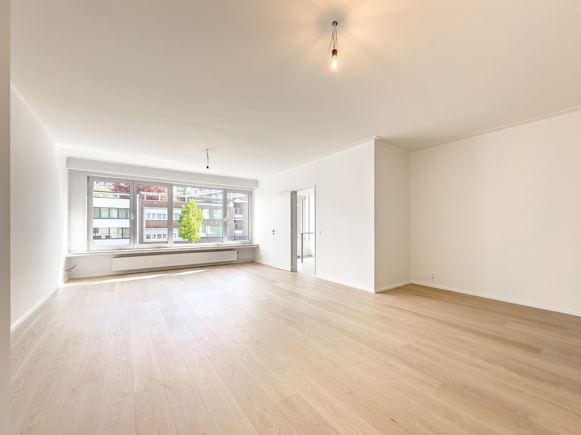 Gerenoveerd appartement met ondergrondse staanplaats - foto 5