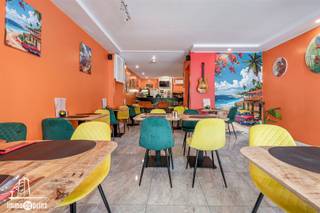 Opbrengsteigendom met handelsruimte, woonst én aanpalende woning – topligging in Sint-NiklaasIdeale investering met een mooie netto rendement van...