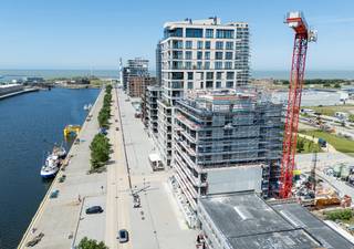 Gelegen aan de Hendrik Baelskaai bieden wij dit exclusieve appartement aan met een subliem zuidwestgericht terras van 33 m², waar je geniet van...