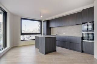 V1L Rivert new build apartment approx 110 m²General Features:- new build project in top location in Antwerp- terrace with unique views of the Scheldt and the Linkeroever marina - underfloor heating- microtopping and customization option- partly sales under registration, partly under VATLayout - entrance hall with separate toilet- living space with beautiful view of the Scheldt- open kitchen with island- storeroom- terrace with sliding windows- 2 bedrooms in the back- bathroom with bathtub and shower- accessible green roof Microtopping “Less is More”This new build project in Antwerp offers several additional options for finishing such as microtopping. Microtopping is a perfect choice for those who love a seamless surface, vertically or horizontally for a unique, elegant and modern look. An endless choice of colours, effects and finishes. Even MoreGoplus gives you even more options in Rivert, which is to fully customize the overall interior. This ranges from an integrated wood veneer wall to partitions, dressing and doors. The sky's the limit! Sales under VAT system.Are you interested in new construction, apartment or property for sale in Antwerp? Please don't hesitate to contact us.If you would like to offer your own property for sale please contact us for a non-binding estimate, by phone at 03/206.76.76 or by email to antwerpen@dewaele.com. You can also contact us for all other questions about real estate, buying or selling in Antwerp!