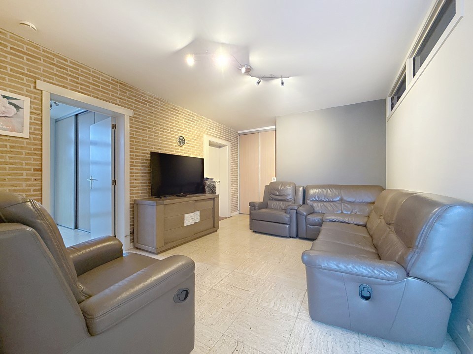 Centraal gelegen gelijkvloers appartement met tuin en garage - foto 4