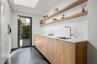 <p><span>Property Information</span></p><p><span>Want to live on a quiet, residential street, with two parks within walking distance and Antwerp nearby? This stylish family home on Du Chastellei combines character, space, and modern comfort. The stately entry hall with its high ceiling and wooden staircase immediately sets the tone. On the ground floor, you’ll find a spacious, air-conditioned living area and an adjoining dining room overlooking the cozy, southeast-facing city garden with colorful hydrangeas. The kitchen was completely renovated in late 2025 and is equipped with high-quality appliances, a ceramic countertop, and plenty of storage space. On the first floor, there is a spacious bedroom, a separate half-bath, and a stylish bathroom with a walk-in shower, also completely renovated in late 2025. The second floor features two more spacious bedrooms of approximately 19 and 20 m², both equipped with air conditioning. The home also scores highly in terms of practicality thanks to its dry basement of approximately 16 m², a spacious driveway with a private charging station, and solar panels with a capacity of 4,345 Wp. Bouckenborghpark and Rozendaalpark are within walking distance, as is the bustling Kroonplein. The center of Antwerp is also easily accessible by bike, car, or public transportation. An open house will be held on August 22, during which you can submit a sealed-bid offer.</span></p><p><span> </span></p><p><span>Layout</span></p><p><span>Basement:</span></p><ul><li><span>Dry basement space of approx. 16 m² with the utility meters for electricity, gas, and water</span></li></ul><p><span> </span></p><p><span>Ground Floor: </span></p><ul><li><span>Stately entry hall with a high ceiling and a characterful wooden staircase, which immediately highlights the home’s charm. Additional space for a coat closet or custom closet</span></li><li><span>Spacious living room (approx. 35 m²) adjoining the dining room, which opens onto the cozy city garden</span></li><li><span>Fully landscaped city garden featuring, among other things, a holly hedge and colorful hydrangea’s. Thanks to its southeast orientation, the garden enjoys plenty of natural sunlight</span></li><li><span>Separate kitchen with a view of the garden, recently completely renovated and equipped with an induction cooktop with integrated range hood, dishwasher, combination oven, refrigerator with separate freezer, ceramic countertop, illuminated cabinets, and an exceptional amount of storage space</span></li><li><span>Separate guest restroom with hand sink</span></li></ul><p><span> </span></p><p><span>1st floor: </span></p><ul><li><span>Bedroom 1 (approx. 16 m²) with hardwood floors, built-in cabinets, and stylish dark wood blinds</span></li><li><span>Completely renovated bathroom with a spacious walk-in shower, wooden bathroom vanity with mirror, and a connection for a washing machine</span></li><li><span>Separate toilet with hand sink</span></li></ul><p><span> </span></p><p><span>2nd floor: </span></p><ul><li><span>Bedroom 2 (approx. 19 m²) with hardwood floors and blinds.</span></li><li><span>Bedroom 3 (approx. 20 m²) with hardwood floors and blinds.</span></li></ul><p><span> </span></p><p><span>Highlights </span></p><ul><li><span>Air conditioning in the living area and the bedrooms on the top floor</span></li><li><span>Spacious driveway with a private charging station</span></li></ul><ul><li><span>Solar panels with a total capacity of 4,345 Wp </span></li></ul><p><span> </span></p><p><span>Open House: August 22</span></p><ul><li><span>Interested buyers will have the opportunity to submit a sealed bid after the open house </span></li><li><span>Starting price for submitting offers: 429,000 euros</span></li><li><span>The seller reserves the right to freely and carefully evaluate each bid </span></li><li><span>All prospective buyers will be notified of the decision or the next steps in the sales process no later than five days after the final viewing day </span></li></ul><p><span> </span></p><p><span>General Information</span></p><ul><li><span>EPC: C rating - 216 kWh/(m²·year)</span></li><li><span>Electrical inspection: pending</span></li><li><span>Asbestos certificate: Not asbestos-free due to approximately 2 meters of pipe insulation. Removal of this insulation is of limited scope</span></li></ul><p><span> </span></p><p><span>Building</span></p><ul><li><span>Very well-maintained home consisting of a basement, ground floor, and two upper floors</span></li></ul><p><span> </span></p><p><span>Location</span></p><ul><li><span>Located on Du Chastellei, undoubtedly one of Merksem’s quietest streets, which opens onto the bustling Kroonplein with its cozy bars and restaurants</span></li><li><span>Bouckenborgh Park and Rozendaal Park are literally just around the corner</span></li><li><span>MOBISCORE: 9.1/10, excellent accessibility by public transportation and bicycle</span></li></ul><p><span> </span></p><p><span>The information in this brochure is provided for informational purposes only: prospective buyers are responsible for obtaining, verifying, and interpreting this information on their own.</span></p><p><span> </span></p>