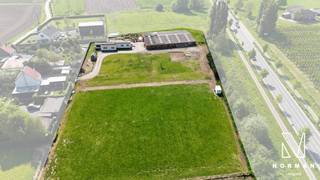+-8230 m² grond te koop met een goedgekeurde bouwvergunning voor een alleenstaande woning. Aansluitend is er ook een loods.Er is een goedgekeurde...