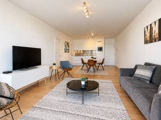 An exceptional flat of approximately 68 m² on the third floor of the stunning Melopee residence. This building, designed by Crepain Binst Architecture on the corner of Rijnkaai and Amsterdamstraat, immediately catches the eye. Its greatest asset is undoubtedly its location, offering unobstructed views of the Scheldt and the city, a sense of spaciousness thanks to the wide streets, and its position at the head of the Eilandje, serving as a natural gateway to the neighbourhood’s vibrant cultural and artistic life.
The flat features high-quality parquet flooring throughout and has been finished to the highest standard.
In the living area, you can enjoy the beautiful, unobstructed view of the Scheldt undisturbed thanks to the large, floor-to-ceiling sliding windows. This opens onto the sun terrace of approximately 5m². The open-plan kitchen is fully fitted and equipped with a hob, oven, fridge and dishwasher. A separate utility room has connections for a washing machine and tumble dryer and provides ample storage space.
The bedroom is cleverly laid out and adjoins a dressing room with ample space for large wardrobes. The bathroom features a walk-in rain shower, washbasin and toilet.
A parking space in the underground garage is available to rent for 150 euros per month.
Monthly charges: 120 euros.
All utilities (water, electricity and gas) are to be met privately by the tenant.
Available immediately.