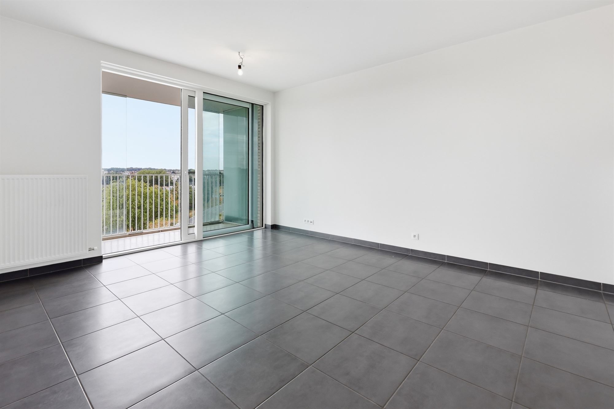 Lichtrijk 1-slaapkamerappartement met ruim terras en staanplaats - foto 4