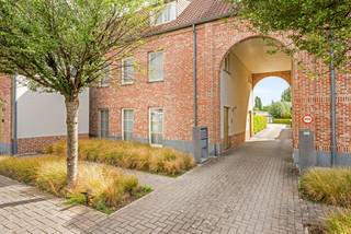 Exclusive living in peace and quiet, just a stone's throw from Hasselt.<br /><br />For those who appreciate space, privacy, and high-quality finishes, this is a special apartment in a sought-after location on the outskirts of Hasselt. Quiet and residential living goes hand in hand with excellent accessibility: the bustling city center is just a few kilometers away, while schools, childcare, shops, entertainment, and daily amenities are easily accessible on foot or by bike.<br /><br />With a living area of a generous 184 m² (source EPC), this apartment feels more like a full-fledged home. The spacious living area is the heart of the space and has been stylishly finished with parquet flooring, a gas fireplace, and a custom-made TV cabinet. Adjacent to this is a separate office space with built-in cabinets – ideal for those who want to comfortably work from home.<br /><br />The open kitchen seamlessly connects to the living area and maintains the same classy style. Large windows provide a pleasant connection to the terrace and the greenery outside, creating a natural flow between indoors and outdoors.<br /><br />Upstairs, there are three full-sized rooms. The bathroom is equipped with both a bathtub and a spacious shower. Home automation, an alarm system, and a separate private entrance emphasize the comfort and exclusive nature of this property.<br /><br />Outside, quality of life has also been considered. A spacious terrace of approximately 16.5 m² overlooks the communal garden, where a swimming pool and play area provide almost a residential holiday feel. A rare combination of privacy and shared facilities, without the maintenance of a traditional villa.<br /><br />Practically, this apartment is exceptionally complete: two parking spaces with charging facilities and two extra-large storage rooms complete the picture.<br /><br />According to the available energy performance certificate, the apartment has 184 m² (source EPC) of usable floor space and an energy score of 188 kWh/(m² year), earning it an energy label of B.<br /><br />This property is for those who are not just looking for an apartment, but for generous and discreet living with the convenience of the city within reach.