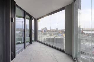 2L Rivert new build apartment ca 96 m² with terraceGeneral Features:- new build project in top location in Antwerp- terrace with unique views of the Scheldt and the Linkeroever marina - underfloor heating- microtopping and customization option- partly sales under registration, partly under VATLayout - entrance hall with separate toilet and cloakroom - living space with beautiful view of the Scheldt- open kitchen with island- storeroom- terrace with sliding system- 2 bedrooms in the back- bathroom with bathtub, shower and double sinkMicrotopping “Less is More”This new build project in Antwerp offers several additional options for finishing such as microtopping. Microtopping is a perfect choice for those who love a seamless surface, vertically or horizontally for a unique, elegant and modern look. An endless choice of colours, effects and finishes. Even MoreGoplus gives you even more options in Rivert, which is to fully customize the overall interior. This ranges from an integrated wood veneer wall to partitions, dressing and doors. The sky's the limit! Sales under VAT system.Are you interested in new construction, apartment or property for sale in Antwerp? Please don't hesitate to contact us.If you would like to offer your own property for sale please contact us for a non-binding estimate, by phone at 03/206.76.76 or by email to antwerpen@dewaele.com. You can also contact us for all other questions about real estate, buying or selling in Antwerp!