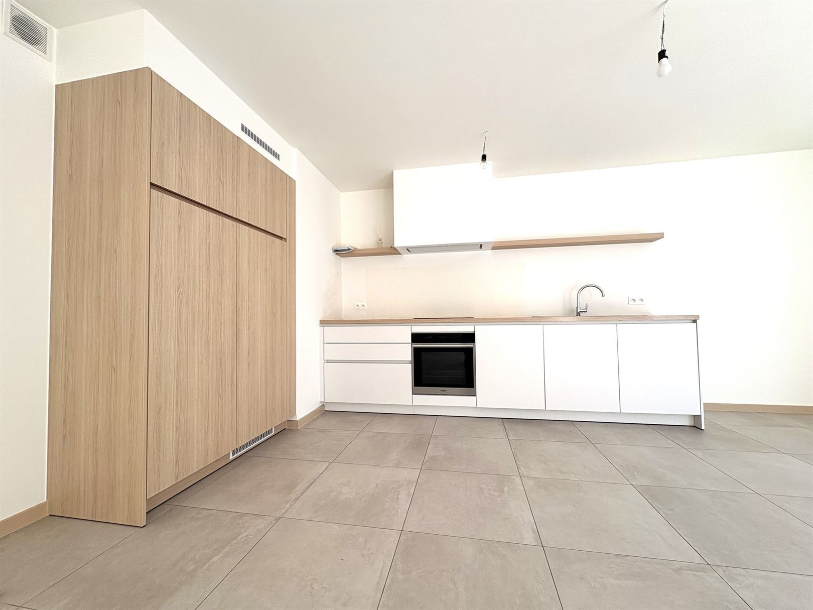 Modern en instapklaar gelijkvloers appartement met terras, tuin en ondergrondse staanplaats in Grembergen - foto 5