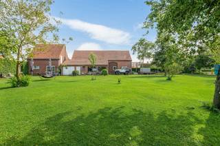 <p><span> </span></p><p><span>This characterful farmhouse with spacious barn is located on the edge of the center of Hoogstraten. All facilities nearby, many possibilities and a unique view! </span></p><p><span> </span></p><p><span>Layout</span></p><p><span>You enter the house through the entrance hall with stairs to the floor and guest toilet, from the entrance hall you reach the living room consisting of a lounge and dining area. Half open kitchen with fitted wardrobes, separate storage room with connections for washer and dryer. </span></p><p><span> </span></p><p><span>1st Floor</span></p><p><span>The nighthall gives access to a spacious bathroom, spacious bedroom, a second bedroom which is used as a dressing room. Also a third bedroom which is currently arranged as an office.</span></p><p><span> </span></p><p><span>2nd Floor</span></p><p><span>Through a staircase you reach the second floor with a multipurpose room or extra room and storage room with heating installation. </span></p><p><span> </span></p><p><span>Barn</span></p><p><span>Behind the house is a large barn with many possibilities.  The barn is over 160 m² with a section with a floor. The barn was built with wooden trusses which give a characteristic look to the whole. </span></p><p><span> </span></p><p><span>Horse at home</span></p><p><span>The presence of a large barn and sufficient land make this a property where you can certainly keep your horses or pony's at home.</span></p><p><span> </span></p><p><span>Rear parcel of agricultural land </span></p><p><span>Adjacent to the spacious garden is an agricultural plot of approximately 1 Ha size. </span></p><p><span> </span></p><p><span>Garden and outdoor areas</span></p><p><span>The landscaped garden offers you plenty of peace and space and a beautiful unobstructed view, including over the own plot of agricultural land.  There are several terraces and possibilities for a covered terrace. </span></p><p><span> </span></p><p><span>Details</span></p><p><span>The house was renovated approximately 15 years ago where the roof was renewed and insulated, windows were replaced and equipped with insulating glazing, and a new central heating system on natural gas. The electrical installation was also renewed and the layout of the house optimized. On the ground floor, the floor was executed in natural stone, on the first floor a parquet floor. Although the living area of the house is limited, there are very practical spaces and many possibilities thanks to the large barn. </span></p><p><span> </span></p><p><span>More information through our office.</span></p>