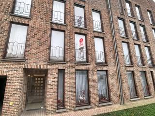 This apartment is located in the heart of Poperinge, in the Doornstraat, within walking distance of the Grote Markt and across the street from WZC Huize Proventier. It is located on the first floor and is accessible by elevator. The apartment has been repainted.Layout: * Floor +1: - entrance hall with cloakroom closet - separate toilet - bright living room with open kitchen with oven, fridge, double sink and ceramic hob with hood- storage - laundry room - bathroom with bath with shower facilities, sink and built-in cupboards- 2 bedrooms (12 &amp; 11 m²)- east-facing terrace* Ground floor 0: - communal bicycle and waste storage=> EPC label B=> Immediately available=> Mostly repainted=> Syndic fees included