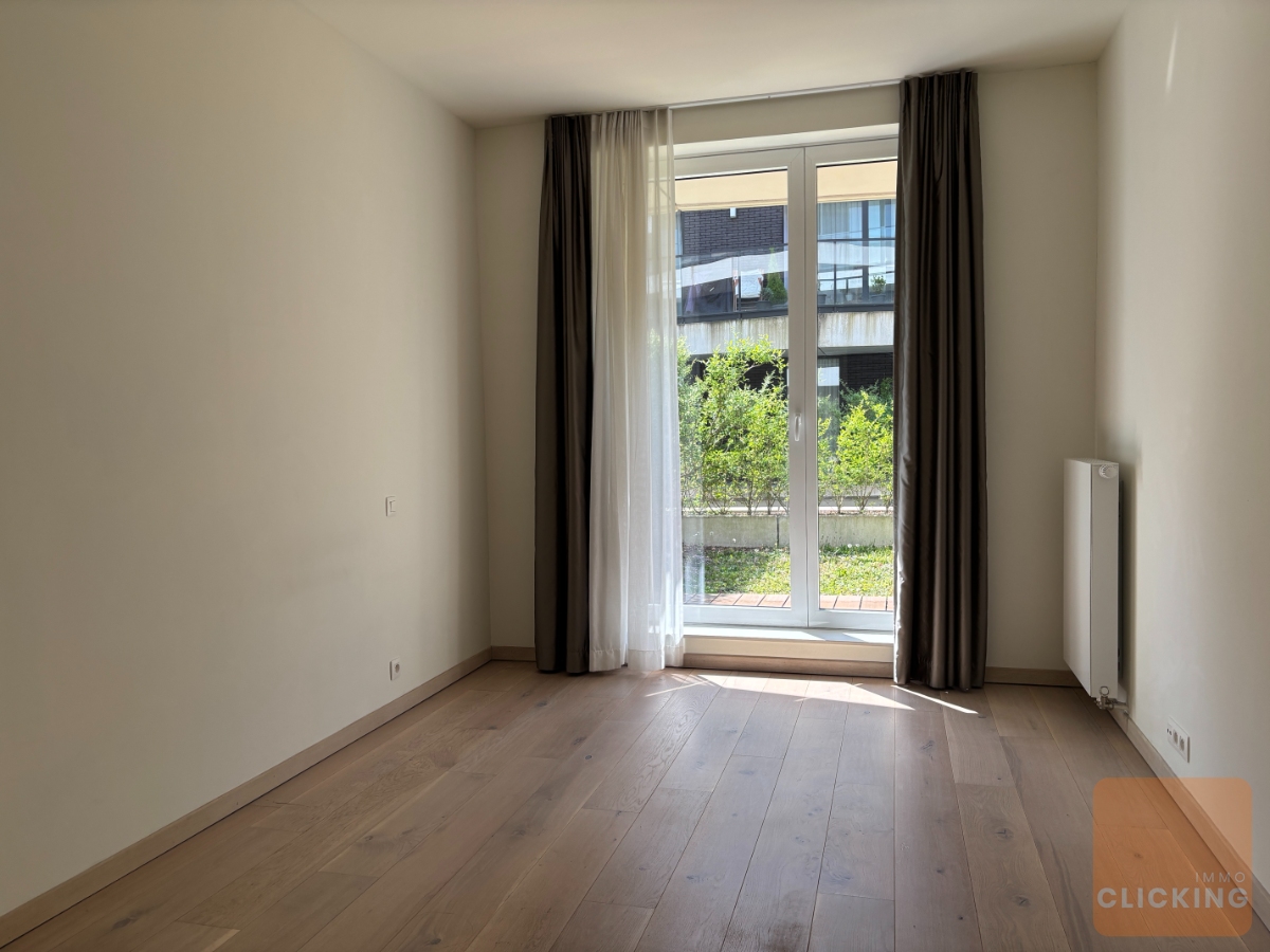 Tof 1 slaapkamerappartement met terras en tuintje - foto 4