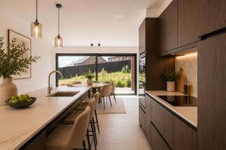 <article><div><div><div><div><div><div><p><strong>Ontdek dit kleinschalig project van 4 energiezuinige woningen waar comfort, kwaliteit en toekomstgericht wonen centraal staan.</strong></p><p>Deze <strong>moderne BEN-woningen</strong> zijn gebouwd volgens de hoogste normen en uitgerust met de <strong>nieuwste technieken</strong> op vlak van energiezuinigheid en wooncomfort. Denk aan optimale isolatie, ventilatiesystemen, hoogwaardige beglazing en duurzame installaties die zorgen voor <strong>lage energiekosten</strong> én maximaal woonplezier.</p><p>Elke woning biedt een <strong>ruime bewoonbare oppervlakte van 144 m²</strong>, ideaal ingedeeld voor gezinnen die op zoek zijn naar licht en ruimte. Bovendien liggen de woningen op <strong>zuidwestgerichte percelen van 256 m² tot maar liefst 791 m²</strong>. Hierdoor geniet je het hele jaar door van <strong>overvloedige natuurlijke lichtinval</strong> en <strong>zonovergoten tuinen</strong> – perfect voor wie houdt van buitenleven, ontspanning en privacy.</p><p><strong>Extra troef:</strong> indien je voldoet aan de wettelijke voorwaarden, kan je deze woning <strong>aankopen aan het verlaagde btw-tarief van 6%</strong>, wat een aanzienlijke financiële besparing oplevert.</p><p><strong>Kortom:</strong> deze ontwikkeling combineert hedendaags design met duurzame technologie, royale ruimtes en een uitstekende ligging. De ideale keuze voor wie toekomstgericht en energiezuinig wil wonen in een mooie, groene omgeving.</p><p>Wil je meer info, plannen inkijken of een bezoek inplannen? Neem gerust contact op: emiel@immobeguin.be</p></div></div></div></div><div></div><div><div></div></div></div></div></article><div></div>
