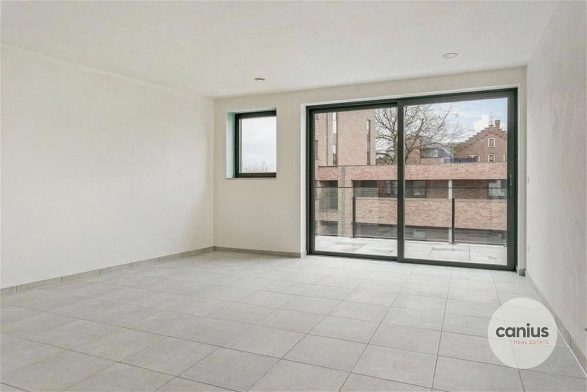 APPARTEMENT MET 2 SLPKS NABIJ HET CENTRUM - foto 3