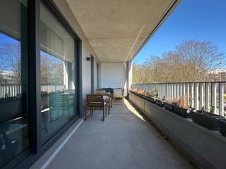 Beautiful apartment with a spacious terrace<br /><br />Apartment (81 m²) with a spacious terrace (21 m²) located on the 2nd floor of the stately new-build project Louise Marie (completed in 2021). If you’re looking for 2 bedrooms, a huge terrace, and a parking space, please read on.<br /><br />Layout:<br /><br />This high-quality new-construction apartment features a terrace of approximately 21 m², accessible separately from the living area and the bedrooms. The bright living area flows seamlessly into the modern kitchen, equipped with AEG appliances (combination oven, dishwasher, refrigerator with freezer compartment, and stovetop), featuring beautiful finishes and plenty of cabinet space. The hallway provides access to the two bright bedrooms. The modern bathroom is equipped with a vanity unit and a walk-in shower. There is also a separate toilet and a storage room for your washing machine and dryer.<br /><br />The underground parking space (No. 55 on level -2) can be rented for €100/month.<br /><br />The monthly common area fees amount to €100/month.<br /><br />Highlights:<br /><br />The apartment is highly energy-efficient (Energy Label A) and exceptionally quiet.<br /><br />The Louise Marie residential complex features a spacious, easily accessible bicycle storage area and a well-equipped fitness room, and benefits from the services of a live-in concierge.<br /><br />Surroundings:<br /><br />The street is located in the Markgrave neighborhood, known for its quiet and residential atmosphere. Close to green spaces, notably the Middelheim-Den Brandt-Nachtegalenpark, Koning Albertpark, and Brilschanspark. For your convenience, there is an Albert Heijn supermarket right on your doorstep. You are also within walking distance of the city center.<br /><br />Special features:<br /><br />Very energy-efficient – communal fitness room – underground parking space – bicycle and trash storage – a spacious east-facing terrace (morning and afternoon sun)