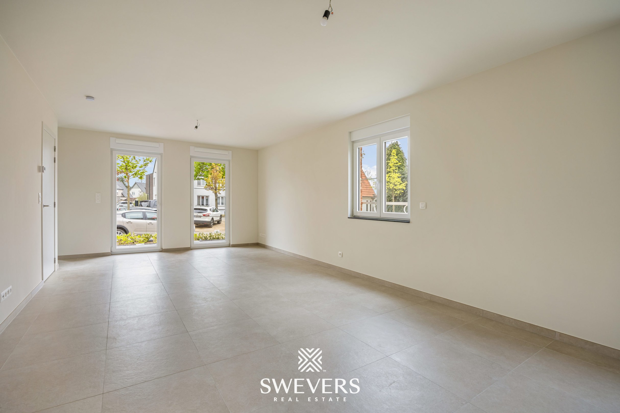 Modern gelijkvloers appartement met privétuin en dubbele parking - foto 3