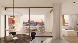 <p>Nestled between the lively waters of the Scheldt and the Bonaparte Dock, a place once known for bananas and trade is making way for an elegant new future defined by balance and beauty.</p>
<p>The site’s fruity past lives on in Friendship Residence, a subtle tribute to its history. The future here is bright and full of potential. This is where the vibrant rhythm of the city merges seamlessly with the calm of the water.</p>
<p>In the fusion of luxury and artistic boldness, Friendship Residence finds its perfect emblem.</p>
<p>Friendship Residence was designed through a collaboration between the Antwerp-based studio HUB Architecten and the London practice DRDH Architects. The result is a unique interplay of local sensibility and international perspective.</p>
<p>Their vision takes shape as a contemporary ode to the historic warehouse architecture of Het Eilandje. Here, there is no fragmentation, only visual harmony. A carefully composed ensemble in which each building has its own identity and atmosphere. A place designed not only for living, but above all for experiencing.</p>
<p>From the outside, Friendship Residence immediately makes a striking impression. High-quality façades with green accents, refined detailing and expansive windows create an aesthetic enrichment for the neighbourhood. Mineral materials were consciously selected to honour the character of the location, ranging from the iconic warehouse style to urban buildings with brick accents.</p>
<p>That sense of quality is felt down to the smallest detail upon arrival. Through the luxurious entrance halls, residents enter the buildings in a stylish transition from the city to their personal haven.</p>
<p>The spacious inner garden was designed by renowned landscape architect Erik Dhont. With internationally acclaimed projects and as laureate of the prestigious competition for the new palace gardens in Brussels, the studio guarantees a landscape design of royal calibre.</p>
<p>The unmistakable charm of this hidden oasis invites residents to slow down and savour the moment. A lush interplay of flowers, shrubs and trees creates a sheltered retreat that briefly makes the pace of the city disappear. Natural stone pathways guide you along a reflective water feature radiating serenity, with inviting resting spots that encourage you to enjoy both sun and shade.</p>