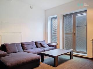 FURNISHED <br />This attractive, furnished  2-bedroom apartment offers a generous net living area of 105 m², complemented by a spacious 40 m² terrace. Located on the 4th floor, the apartment enjoys open and unobstructed views over Leuven’s city centre.<br /><br />The property includes a private cellar storage and access to a secure bicycle storage room. In addition, there is the option to rent one or two underground parking spaces, a rare and valuable asset in the city centre.<br /><br />Situated in the sought-after residence “’t Rood Huys”, the apartment benefits from a prime central location in the vibrant university city of Leuven, within walking distance of the historic city centre, the Oude Markt, shopping streets, restaurants and public transport. At the same time, residents can enjoy a peaceful and green environment, thanks to the nearby River Dijle and the beautifully landscaped inner courtyard.<br /><br />An ideal home for those seeking space, comfort and a central location, combined with tranquillity and pleasant views.<br /><br />For visits please contact us WE INEST MEISE 02 262 45 78 /meise@weinvest.be