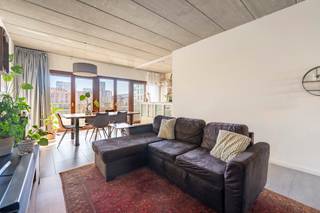 <p>This exceptional loft apartment is located in a characterful brutalist building in a prime location on Antwerp's Eilandje. The exposed concrete ceiling gives the interior a powerful, architectural look that blends perfectly with the clean lines and abundant natural light.</p>
<p><span>The apartment has been built with energy efficiency in mind and offers an extremely flexible floor plan: everything can be perfectly arranged as one open, loft-like space. The fully fitted kitchen connects seamlessly to the dining room and living room, which together enjoy a beautiful view of the water — a daily feeling of peace and space.</span></p>