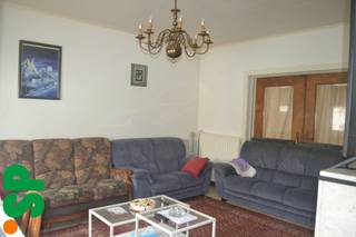 Centraal gelegen woning bestaande uit inkomhall, leefruimte, keuken, veranda, badkamer, kelder, 2 slaapkamers, zolder, garage, terras en tuin.EPC:...