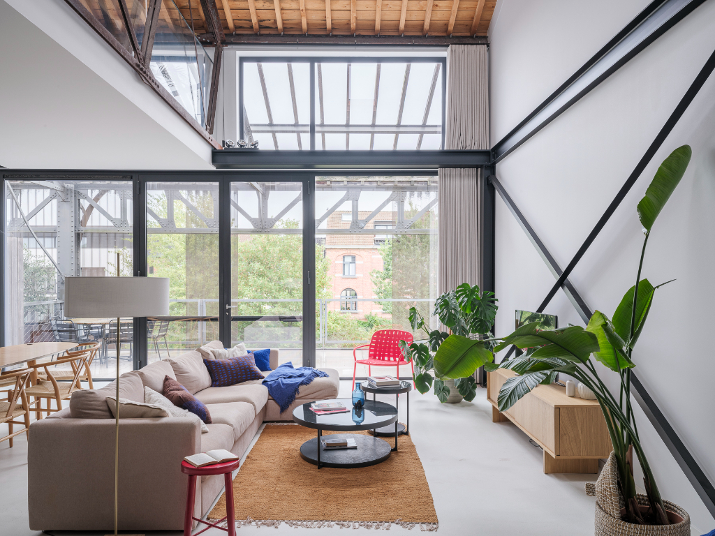Luxueus en tijdloos – Exceptionele loft met 2 slaapkamers, aparte bureauruimte en ruim terras in een beschermd gebouw met een rijke industriële voorgeschiedenis. - photo 5