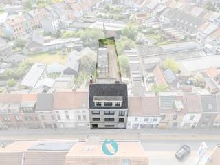 Opbrengsteigendom bestaande uit 4 appartementen, 10 garages en 4 staanplaatsen, gelegen op een strategische locatie langs de Dendermondsesteenweg...