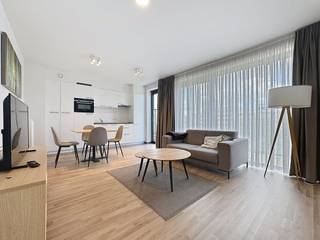 Près de Tour & Taxi, à l'Allée Verte 6, à Bruxelles, appartement meublé de ± 62 m² à vendre en parfait état. Il est situé au 6ème étage d'un immeuble récent (2017) et propose :- hall d'entrée spacieux,- salon ensoleillé avec parquet, coin bureau séparé, cuisine ouverte entièrement équipée,- terrasse ouest de ± 15 m², avec vue sur le canal et sur le palais de Laeken et l'Atomium,- une chambre à coucher spacieuse,- salle de douches avec douche, lavabo et toilettes,- cave,- possibilité d'acheter jusqu'à 5 emplacements de parking supplémentaires (± 25 000 euros/pièce).Autres caractéristiques :- PEB : C+, 108 kWh/ (m²/an),- certificat de contrôle électrique en conformité,- idéal comme investissement ou comme résidence privée.