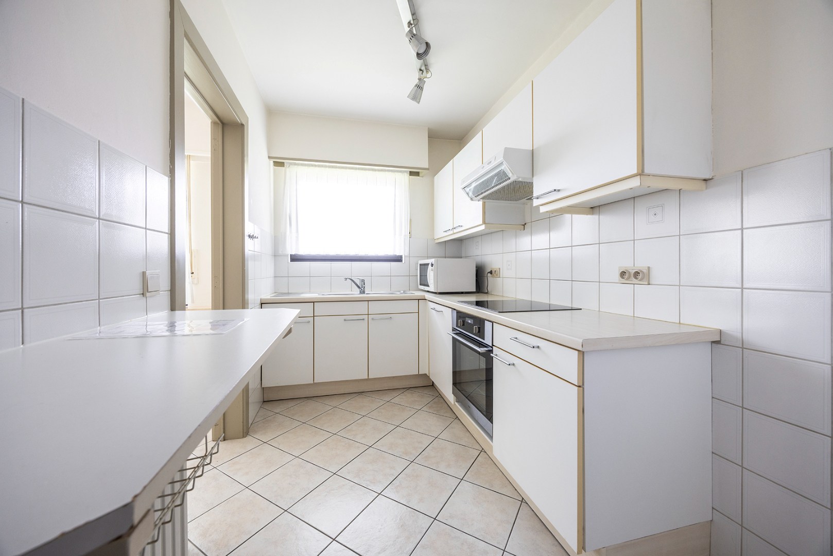 Gelijkvloers appartement met 3 slaapkamers en tuin - foto 5