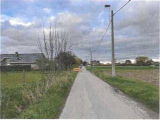 Perceel grond gelegen in gemengd open ruimte gebied.Sectie A perceelnummer 0242/00E000Breedte aan de straatkant : 25,20meterDiepte perceel :...