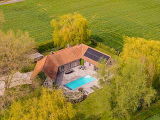 Te koop: charmante hoeve met zwembad op 3500m2 in Kruisem. In het landelijke en gegeerde Kruisem bevindt zich deze prachtige hoeve op...