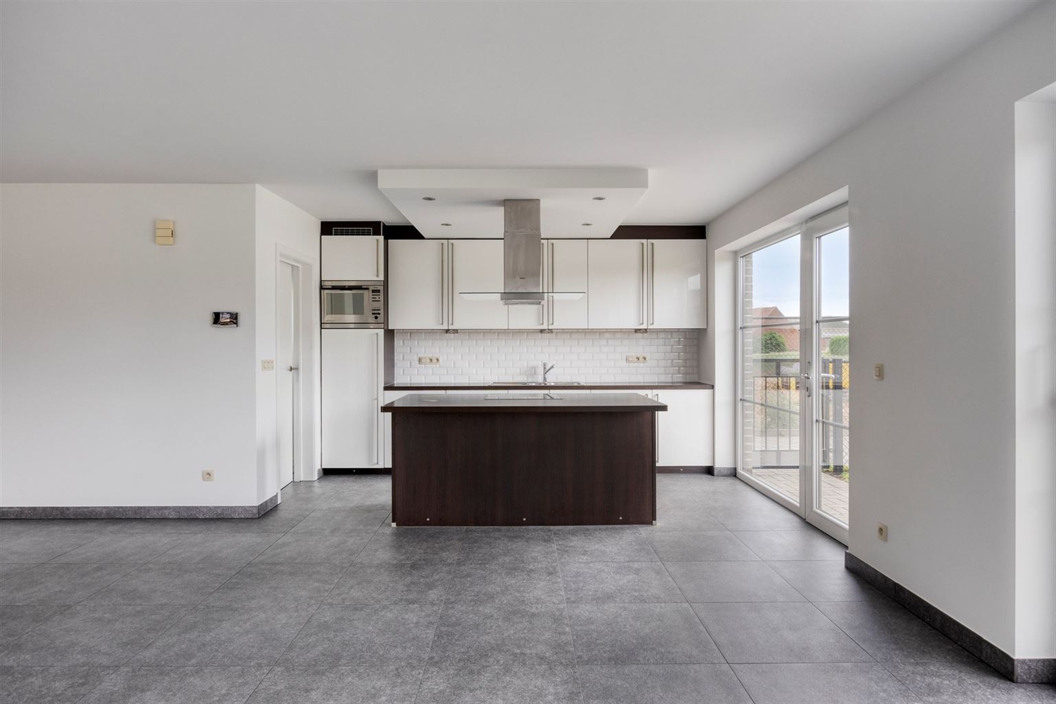 Instapklaar gelijkvloers appartement met 2 slaapkamers, ruime tuin en parkeergelegenheid op een rustige toplocatie in Opitter.  - foto 5