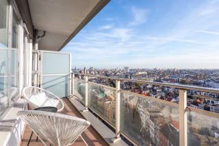 Located on Brederodestraat in a sought-after area of Antwerp, this apartment offers easy access to the city center, numerous shops, restaurants, and public transportation nearby. You are also just a short distance from the vibrant Zuid district, known for its cozy terraces, dining options, and cultural hotspots. This makes it an ideal base for those who want urban living with all amenities within reach.<br /><br />Situated on the 15th floor of a well-maintained building, this apartment is easily accessible by elevator. Upon entering, you are welcomed by an entrance hall featuring practical coat closets.<br /><br />The bright living area is the heart of the apartment, with large windows that create an open and inviting atmosphere. There is ample space for a comfortable seating area and dining table, while the open kitchen is equipped with all necessary built-in appliances and seamlessly connects to the living space. From here, you also step out onto the terrace, where you can enjoy unique views over the city. Adjacent to the kitchen, you will find a convenient storage room, perfect for extra storage.<br /><br />The apartment includes a spacious bedroom and a bathroom fitted with a shower bath, a sink with storage cabinet, and a toilet.<br /><br />In short, this pleasant high-floor apartment combines light, comfort, and stunning views in a central Antwerp location.<br /><br />Interested? <br />Contact LISTED for a viewing: +32 3 283 51 51.