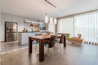 This luxury apartment is located on the top floor. It features a beautiful living space with an adjoining terrace, a fully equipped kitchen with storage room, 3 bedrooms, 2 bathrooms, and a private entrance hall. In the basement, there are 2 open parking spaces and a separate storage room.<br /><br />Luxurious finish!<br /><br />Layout:<br />The apartment is accessible via a staircase and an elevator that opens directly into the entrance hall exclusively for the apartment itself. You enter a spacious entrance hall with a guest toilet. From here, you have access to the bedrooms at the back and to the living area. The living space is very spacious and is divided into a sitting area and a dining area. You have access to the cozy terrace over the entire length of the living space. The terrace has a sunshade.<br /><br />The living space seamlessly transitions into the beautiful, fully equipped kitchen. The kitchen is equipped with high-quality appliances. Adjacent to the kitchen, there is a cool storage/laundry room.<br /><br />The hallway provides access to 3 beautiful bedrooms and 2 bathrooms. The master bedroom has an adjoining dressing room. The main bathroom is equipped with a walk-in shower, double sink, and toilet. The second bathroom has a walk-in shower, sink, and toilet.<br /><br />In the basement, there are 2 spacious parking spaces and a practical storage room.<br /><br />Special features:<br />- Wheelchair accessible<br />- Entrance hall completely private for the penthouse<br />- 2 parking spaces and very spacious storage<br />- 3 spacious bedrooms and 2 full bathrooms<br />- 3 toilets<br />- Located within walking distance of the center of Lommel