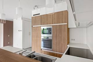 <p><span>Looking for a move-in-ready apartment in a recently built, small-scale residence? Then this spacious one-bedroom apartment, built in </span><span>2016</span><span>, is </span><span> definitely worth a visit. Thanks to its </span><span>energy-efficient EPC rating of A</span><span>, </span><span>underfloor heating</span>,<span> and </span><span>low common</span><span> area </span><span>fees</span>,<span> you’ll enjoy optimal living comfort and low monthly costs here.</span></p><p><span>Through the entryway with built-in closets, you’ll reach the bright living area. The dining room and living room are subtly separated yet remain open to each other, creating a cozy and practical layout. Adjacent to this is the spacious, </span><span>south-facing terrace</span><span>, where you can enjoy the sun all day long.</span></p><p><span>The apartment also features a spacious bedroom with enough room to create a walk-in closet if desired, an adjoining bathroom, a separate guest restroom, and a practical storage/laundry room.</span></p><p><span>The basement level features a </span><span>private parking space</span><span>, a </span><span>private storage room</span><span>, and a </span><span>communal bicycle storage area</span><span>, rounding out the amenities.</span></p><p><span>Thanks to its recent construction, favorable energy rating, and high-quality finishes, this apartment is not only ideal for owner-occupancy but also an excellent investment.</span></p>