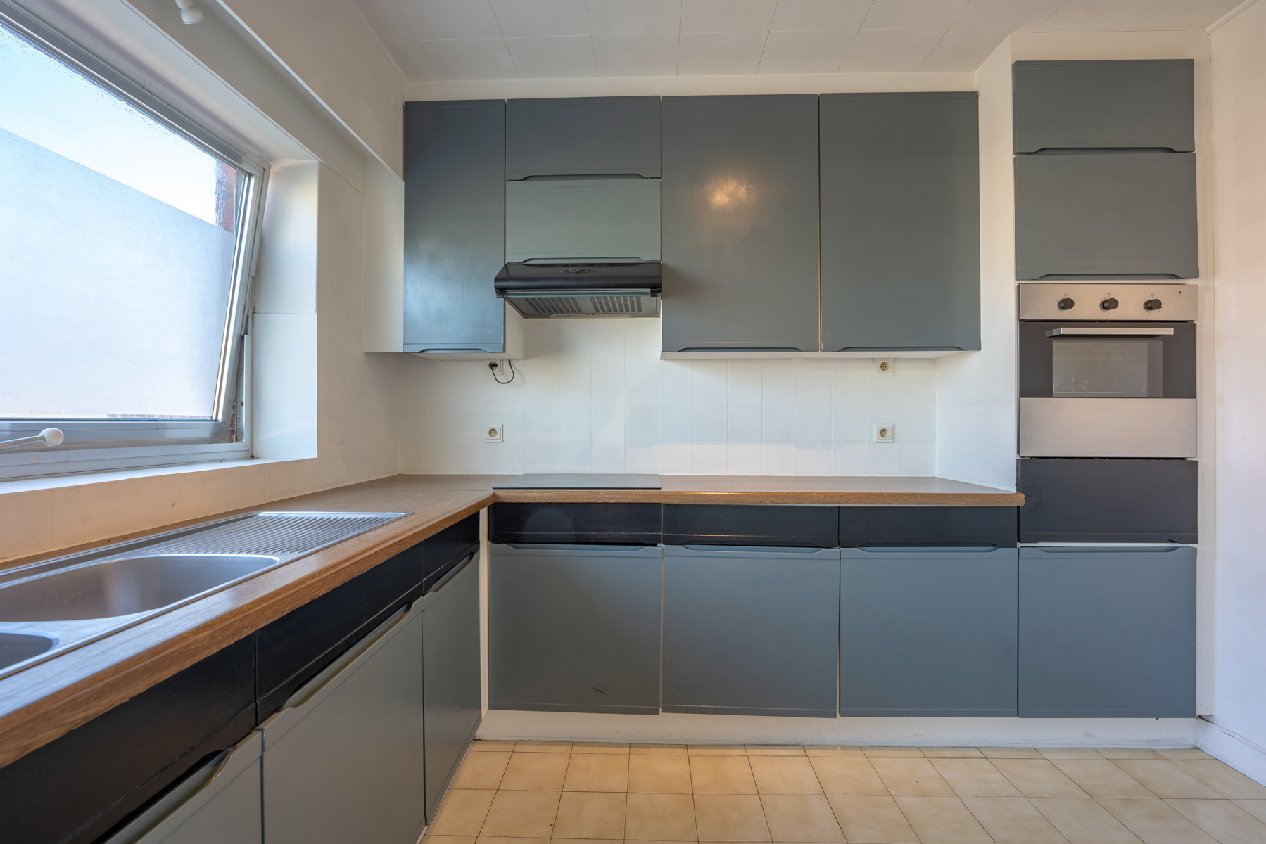 Opbrengsteigendom met 2 appartementen, inpandige garage en tuin - foto 5