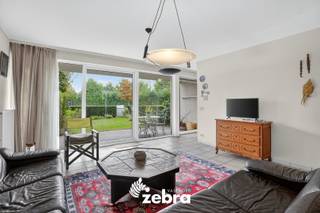 Rustig en gunstig gelegen 2-slaapkamer gelijkvloers appartement met terras en tuin en mogelijkheid tot aankoop vlot bereikbare privatieve...