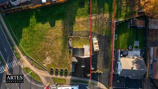 Bouwgrond van 2a10ca voor een HALFOPEN BEBOUWING, rechts van de woning aan de Kerkstraat 1.Breedte: 13 mDiepte: 32 mBijgevoegd voorbeeldplannen van...