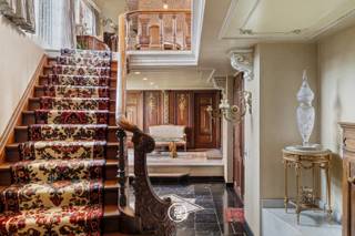 This beautiful villa, built in 1983 by renowned real estate designer M. Raymaekers, exudes charm and class upon entry thanks to the use of authentic materials and original elements. The impressive property is infused with beautiful woodwork, inlay, and curved ceilings, creating a unique atmosphere. Equipped with luxury amenities such as an elevator, an impressive facade, air conditioning, and a tennis court.<br /><br />Conveniently located in Hasselt, this property not only offers proximity to the city center but also a central location in relation to the E313 highway.<br /><br />Upon entering the ground floor, the spacious entrance hall immediately catches the eye, with its unique inlay in the natural stone floor and high ceilings with ornaments and moldings. On this floor, you will also find the master bedroom with access to the terrace, a luxurious marble bathroom, and two other bedrooms with their own bathroom facilities.<br /><br />The first floor welcomes you with a cozy living space, complete with a fireplace, a dining room, and a fully equipped kitchen. On the second floor, you will find two more spacious bedrooms or hobby rooms.<br /><br />The basement, at garden level, accommodates large indoor garages with automatic gates and various practical storage spaces.<br /><br />The park garden is an oasis of peace and greenery, with a tennis court, large pond, and several cozy terraces. At the back of the property, there is a well-maintained garden house with a terrace, where you can enjoy the view of both the water feature and the tennis court. The rural and peaceful location on the outskirts of the city completes the picture!