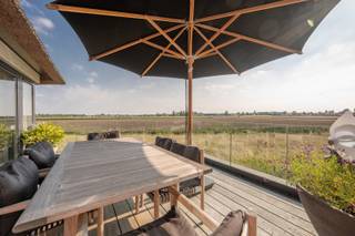 Fantastic house for sale in Knokke with breathtaking views and sunshine all day long<br />This recent (2017) and perfectly maintained property with a living area of approx. 320 m² combines space, light, and phenomenal views. Thanks to its southwest orientation, you can enjoy the sun all day and a unique panorama.<br />Layout:<br />Ground floor: entrance hall with guest toilet, storage room, and integrated garage. A bedroom (currently used as an office) with a separate shower room (connections provided, not yet installed).<br />First floor: spacious living room with gas fireplace and large windows opening onto a sunny terrace with spectacular views. Adjoining dining area and semi-open, fully equipped kitchen. Additional storage room.<br />Second floor: master bedroom with built-in wardrobes and ensuite shower room. Third bedroom with fitted wardrobes and private bathroom. Fourth room, currently used as a dressing room, also with shower room.<br />Additional features: alarm system, energy-efficient EPC (78), high-quality finishes, and move-in ready.<br />A unique opportunity to live in full comfort in a prime location in Knokke, with views that will never cease to impress.<br /><br />For more information or a visit, please contact Tine Vandenberghe:<br />T: +32 497 53 45 29 or info@Tine.immo<br />You can find the video below: virtual tour.