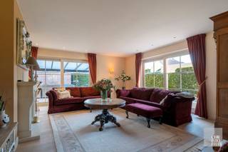 LAYOUTThrough the central entrance hall with an elegant staircase, you enter the spacious, country-style kitchen featuring a blue stone countertop...