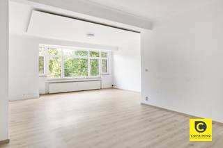 <p><span>Spacious, move-in-ready 1- or 2-bedroom apartment at 't Stadspark!</span><span><br /><br /></span></p><p><span> </span></p><p><span>Filled with passion and expertise, this spacious apartment (105 m²) with a favorable EPC rating has been renovated to a high standard and with great style. It is located on the</span><span><sup>2nd</sup></span><span> floor of a small-scale building with an elevator and enjoys phenomenal natural light. This dream location is just a stone’s throw from Harmonie Park and close to PAKT, an initiative by creative entrepreneurs and urban farmers focused on greener living, self-sufficiency, culture, and gastronomy. Shops, parks, schools, restaurants, and sports facilities are all nearby, as is Antwerp’s vibrant city life, and accessibility is excellent thanks to various access roads and public transportation. In short, the perfect place where modern comfort goes hand in hand with a perfect work-life balance. Don’t miss out on this unique opportunity!</span></p><p><span><br />Entrance hall, living room, kitchen &, laundry room:</span></p><p><span>You enter the apartment through the entry hall, which features a security door and a videophone. The modern steel interior door, as well as the light, solid wood parquet flooring that extends seamlessly throughout nearly the entire apartment, immediately catch the eye and are accentuated by the omnipresent designer lighting. The spacious living area (approx. 31 m²) enjoys a truly magnificent influx of light thanks to the many large aluminum- "-steel-look" windows, ensuring an excellent quality of life. The charming decorative fireplace and the beautiful moldings contribute to the home’s unique character, atmosphere, and coziness. The eye-catching open kitchen, featuring a magnificent ceramic countertop, sits on a travertine-look tile floor, offers ample work and storage space, and is equipped with high-quality appliances. Adjacent to it is the separate laundry room, which provides ample space for your pantry supplies and cleaning supplies.</span></p><p><span> </span></p><p><span>Bedrooms, bathroom & e toilet:</span></p><p><span>Two of the three bedrooms open onto the terrace; all feature hardwood floors and overlook the greenery at the rear. The smaller room is perfect as a walk-in closet, home office, children’s room, or guest room. In the luxurious bathroom, you can completely unwind in the spacious walk-in/rain shower. It also features a double vanity with sinks and waterfall faucets, a towel radiator, and mechanical ventilation. The separate toilet with a hand sink is located elsewhere.</span><span><br /><br />Terraces, basement &, and bike storage:</span><span><br />Through the kitchen, you have access to the cozy indoor terrace at the front with a built-in storage area. The extra-wide south-facing terrace is located at the rear, adjacent to the bedrooms. With a touch of natural beauty to top it off, this is a phenomenal place to completely unwind after a busy workday, whether or not with a good glass of wine in hand. It’s a unique opportunity to dine al fresco, relax in the lounge, or garden at this elevation right in the heart of the city every day. Also worth noting is the private, dry basement storage room (4 m²) that’s included. In addition, the building features a bike storage area where your bike will always be kept dry and safe.</span></p><p><span><br />Additional highlights:</span></p><p><span>- Prime location (Mobiscore 9.5/10)</span></p><p><span>- EPC B</span></p><p><span>- 105 m² according to EPC</span></p><p><span>- First occupancy after renovation</span></p><p><span>- High-quality finishes</span></p><p><span>- New high-efficiency windows (", aluminum steel-look")</span></p><p><span>- New radiators</span></p><p><span>- Electrical system up to code</span></p><p><span>- 2 terraces</span></p><p><span>- 3 bedrooms</span></p><p><span>- Includes designer lighting</span></p><p><span>- Asbestos-safe<br />- Basement and bike storage</span></p><p><span> </span></p>