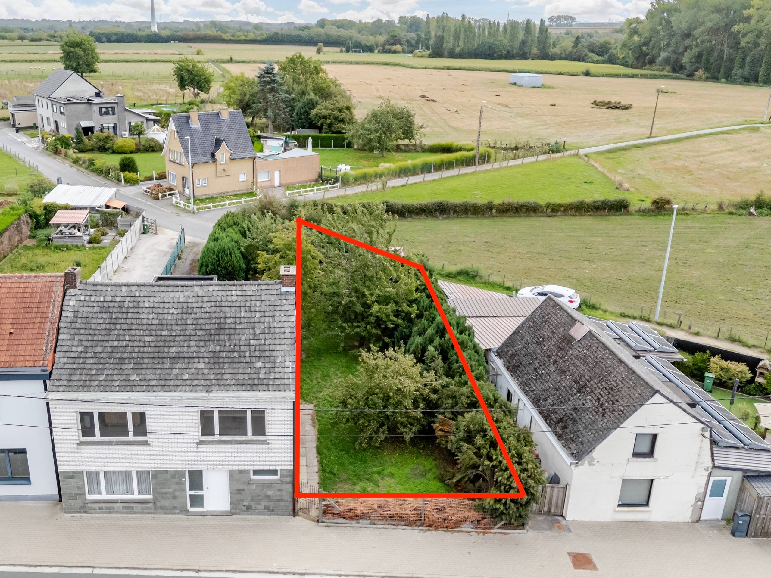 Gesloten bouwlot van 270 m² in het groene Denderhoutem - foto 1