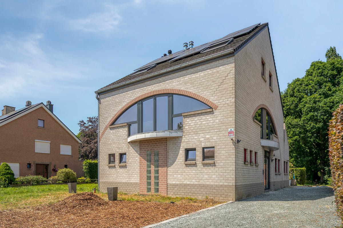 Immeuble de deux appartements dans un excellent emplacement à Humbeek avec un grand jardin et des possibilités de parking - photo 1