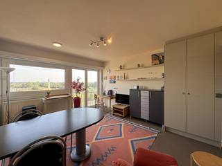 This tastefully decorated apartment is located in a prime location, just behind the sea dike of Heist. Thanks to its south-facing orientation, you can enjoy pleasant natural light and a sunny living space. Ideal as a second home by the sea or as an investment for holiday rentals.<br /><br />The apartment has been practically laid out and fitted with custom-made furniture, making optimal use of every space. In addition, there is surprisingly plenty of storage space available.<br /><br />Layout:<br />- Entrance hall,<br />- Cozy living room with seating area and dining area,<br />- Separate bedroom with custom-made bed and built-in wardrobes,<br />- Fully equipped kitchen with all comforts, including a dishwasher,<br />- Bathroom with shower, sink, and toilet,<br /><br />The furniture can be taken over for an additional cost.<br /><br />A ready-to-move-in apartment in a magnificent location, just a few steps from the sea and beach - perfect for those looking for a carefree stay on the coast.
