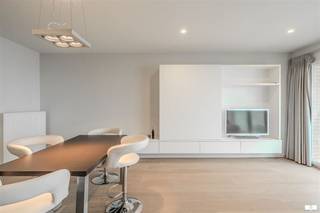 Welcome to this beautiful modern apartment in Middelkerke, an ideal living place for those who like to live with central sea view. This elegantly furnished apartment combines comfort with style and offers excellent quality of life.The interior features luxurious finishes and contemporary design elements. The open-plan living space features large windows that let in plenty of natural light and offer beautiful views of the North Sea. This is the perfect setting for both relaxation and working from home.The bedroom is spacious and serene with built-in closets that offer optimal storage options. The bathroom is modern with stylish tiles and contemporary plumbing fixtures.The kitchen is fully installed with high-quality appliances and a practical layout that makes cooking enjoyable. All rooms have warm wooden floors that add charm and warmth.Possibility to purchase garage in the building for an additional cost of 80,000 euros.