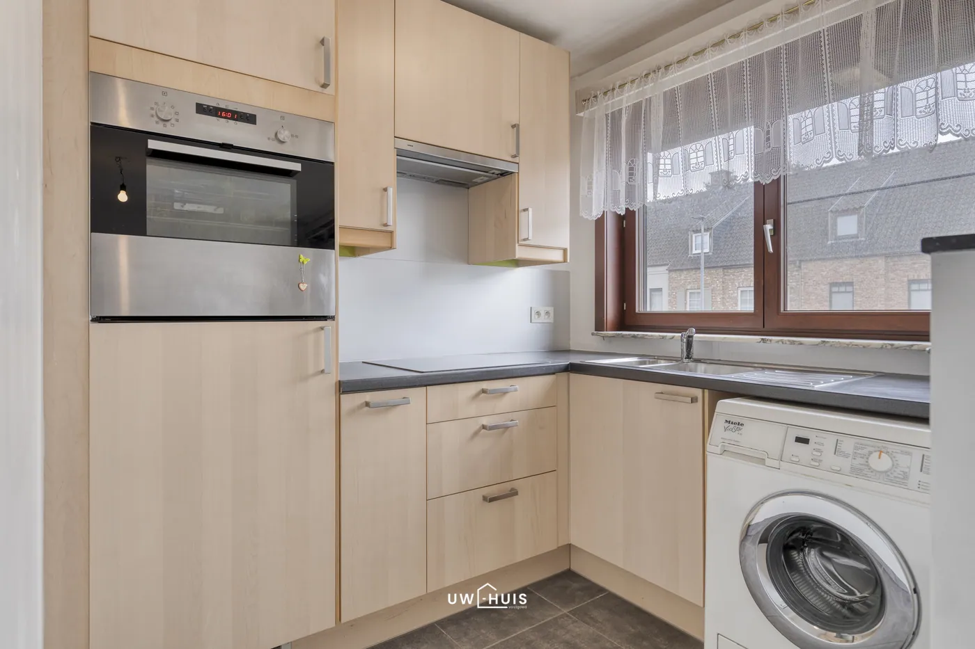 Gezellig appartement met 2 slaapkamers en garage op goede ligging! - foto 5