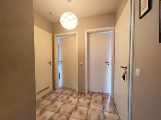 Appartement op het 2de verdiep met garageAppartement op de tweede verdieping (geen lift).Indeling: inkomhal, woonkamer met open keuken, 2 slaapkamers...