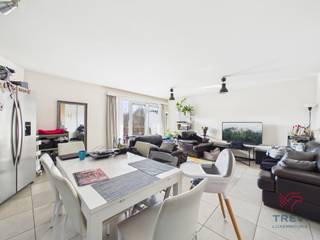 6700 ARLON (Wäschbour, 22-24 lot A105) – On the edge of the countryside, ideally located and close to all amenities (shops, schools, public transport, etc.), 10 minutes by car from Luxembourg, close to Arlon city center and 30 minutes from the economic center of the Grand Duchy. TREVI offers you this beautiful 2-bedroom apartment in a building dating from 2007, comprising: entrance hall, separate toilet, living room, fully equipped kitchen, 2 bedrooms, bathroom, laundry room, and terrace. In the basement, there is a private cellar (no. C11). Parking and/or garage available at an additional cost. <br /><br />** TECHNICAL **<br />- PEB: B; 19 kg/C02/m²/year; 93kwh/m²/year; unique code: 20230310023952;<br />- NEW communal gas boiler with hot/cold water meters;<br />- Water softener;<br />- Electricity confirmed;<br /><br />**FINANCIAL CONDITIONS**<br />Asking price: €290,000<br />Charges: €150/month for private hot and cold water + heating + communal areas<br />The property is sold occupied with a base rent of €885/month starting on 02/26/2021 (9-year lease) including parking.<br />Sale price subject to registration fees (3% or 12.5% depending on conditions)<br />Basic deed fees payable by the buyer (± €800 excluding VAT)